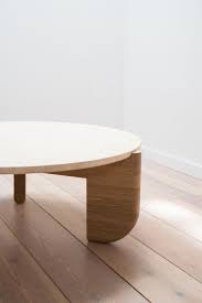 This rectangular transforming coffee table helps save space with its adjustable height glass top sitting lightly on a metal frame. Tripod Coffee Table White Oak And Travertine White Oak Coffee Table Coffee Table Stone Coffee Table