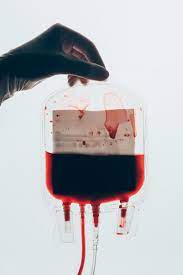 I get my blood bags out. Cropped Shot Of Doctor Holding Plastic Bag Free Stock Photo And Image