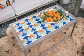 After 30 minutes, use a paper towel or damp sponge to wipe the grout haze off the mosaic tiles. How To Tile An Outdoor Table Tutorial Hunker