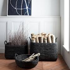 Heated until pliable, sustainable rattan weaves a simple and elegant round basket. Woven Seagrass Baskets Black