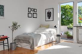 Photo also showed a barn door into bath. Small Apartment Decorating Ideas Tips How To Design Small Spaces Lazy Loft