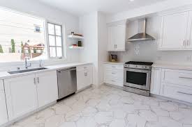 Beautiful Clean White Kitchen With Carrara Marble Countertops And Floors And Stainless Steel Appli Marble Floor Kitchen Kitchen Marble Marble Kitchen Worktops