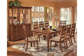 The Clifton Park Dining Room Extension Table From Ashley Furniture Homestore Afhs Com The Unique Contemporary Design And Soft Warm Finish Come Together To C