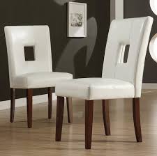 Gorgeous camelback design distinguishes these elegant side chairs while lustrous nailheads contour the curved front and continue throughout the design. Tribecca Home Alsace Modern White Faux Leather Upholstered Dining Room Side Chairs Set Of 2 Buy Online In Antigua And Barbuda At Antigua Desertcart Com Productid 44891361