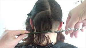 Part your thick, wide curls to the side or in. A Curly Bob Haircut With Shaved Undercut Youtube