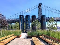 Trade out manhattan tourists for a true williamsburg family scene complete with a sand volleyball court, bocce ball, soccer field, playground, play fountain, food trucks and dog park. Visiting Domino Park Williamsburg S Waterfront Park Hello Little Home