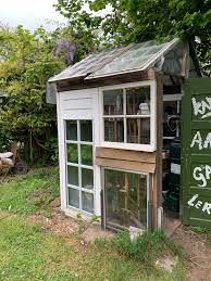 I've dreamt of having a huge greenhouse made of old window panes but the hubby didn't think it was a good idea being that we don't have a large backyard. A Greenhouse We Build Two Years Ago From Old Windows And Doors Gardening
