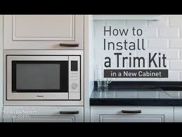 The cabinet is screwed to the wall then the microwave screwed to the cabinet. How To Install A Panasonic Trim Kit In A Cabinet Youtube