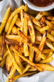 Pomme feminine de terre, pomme de terre, pomme de terre. Baked French Fries With Curried Ketchup Naturally