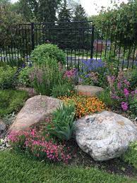 Design ideas for a contemporary partial sun side yard river rock lawn edging in other. Easy Ideas For Landscaping With Rocks