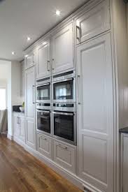 Miele Ovens Flanked By Tall Larder And Integrated Fridge Freezer Integrated Kitchen Appliances Integrated Fridge Miele Kitchen