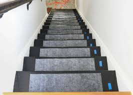 Try to line up the staples on the heights' padding with the ones you've made for the treads. Yellowbrickhome How To Install A Stair Runner Homes Com