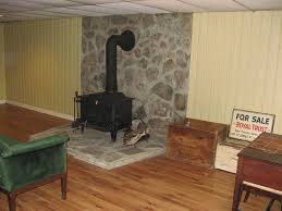 One common piece of advice for siting a rocket mass heater is that it should be in your common living area. Warm Wood Stove In Basement See Our Video At House For Sal Flickr