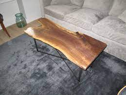 Made from solid american walnut, its angled legs are sculptural, yet sturdy, giving it a great fit for smaller spaces. Hand Crafted Live Edge Black Walnut Coffee Table By Iron Boar Metal Works Custommade Com