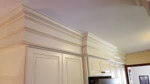 Eye Catching Details Just Over 12 Inches Of Stacked Crown Above The Cabinets The Built In Around Fireplace Crown Molding Kitchen Kitchen Cabinet Door Styles