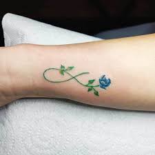 Top 41 Best Infinity Tattoos 2021 Inspiration Guide Infinity Tattoo Designs Infinity Tattoos Flower Wrist Tattoos