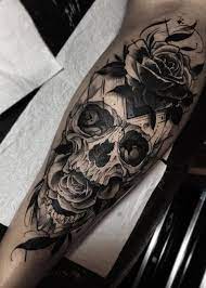 Skull rose tattoo on foot supremely done with black shaded waves. 50 Skull Rose Tattoos Meanings Tattoo Designs More