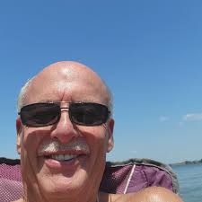 What are the best places with a beach to anchor a boat and let kids swim  near Cedar Creek Lake?