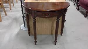 Half moon shape design with wooden frame and one bottom shelf. Solid Mahogany Half Moon Table With Drawer