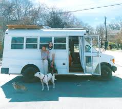 UGA grads Sam Burchfield and Pip the Pansy move life into school bus