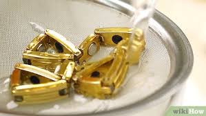 Cleaning your gold jewelry is a very simple process and should be done to clean off the oils from your skin, hair spray, etc. 4 Ways To Clean Gold Jewelry Wikihow