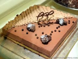 Decorating cakes with chocolate is quick, easy and all you need is chocolate chips, a sheet of parchment paper and something to pipe it with. Square Chocolate Mousse Cake With Nice Decorations Jpg Hi Res 1440p Qhd