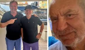 Met a fan' Piers Morgan and Lord Alan Sugar bury hatchet as they pose for  smiley photo