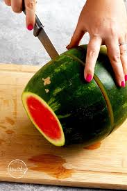 One flat end will become the base with an ice cream scoop, remove the middle of the watermelon from the top side, placing the chunks in a nearby bowl for snacking (don't let any go. How To Cut Watermelon How To Peel And Cut Into Spears Cubes A Pinch Of Healthy
