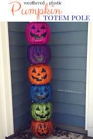 This plastic pumpkin bucket makeover is a great dollar store craft that'll let you move your decor from halloween to fall in a snap! How To Make A Fun Pumpkin Totem Pole Perfect For Halloween Twitchetts