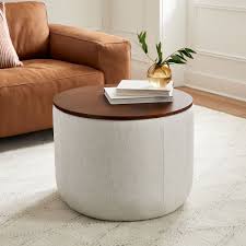 This ottoman is a great double for a coffee table. Upholstered Round Storage Ottoman