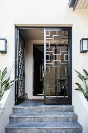 What kind of door does home depot use? Metal Frame Door In Front Of Foyer Grill Door Design Doors Interior Modern Steel Door Design