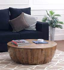 Munching snacks in front of tv, reading newspaper in cozy mornings, remembering old gone days with your friends or be it spending evenings with family all your lounge life encompasses is one important piece of furniture; Buy Drum Coffee Table In Natural Finish By The Armchair Online Round Coffee Tables Tables Furniture Pepperfry Product Drum Coffee Table Coffee Table Wood Mango Wood Coffee Table