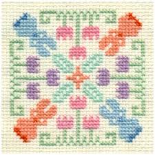 Free patterns / free patterns / free cross stitch patterns. Bunnies And Tulips Biscornu Free Cross Stitch Pattern