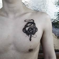 Black And Gold Snake Tattoo Snake And Headphones Tattoo Inked On The Left Side Of The Chest Headphones Tattoo Ink Tattoo Tattoos