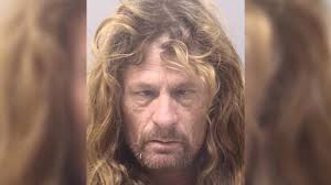 Police: Texas man armed with rifle arrested after getting trapped in wall  of high school gym