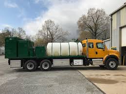 Let us move your valuables. Elliott Machine Works Milling Paving Support Trucks Nichols Fleet