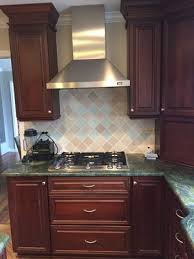 For a stainless look at a lower cost, investigate stainless cabinets with mdf/wood parts. Gorgeous Omega Dark Wood Cherry Complete Kitchen New Stainless Steel Appliances Dacor Granite Little Green Kitchens