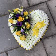 All of from you flowers funeral flowers are arranged by a local florist and are available for delivery today. Yellow White And Purple Heart Shaped Funeral Flowers Wreath Tribute Funeral Flower Arrangements Funeral Flowers Flower Arrangements Diy