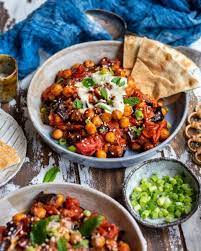 Chickpea Aubergine Harissa Tray Bake Vegan Recipes Vegan News Plant Based Living Food Health More Tray Bakes Tray Bake Recipes Recipes