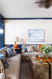 We also have embellished coffee tables like a mirrored coffee table, trunk coffee table and for those who wish to keep it light and trendy, you can go for the light wood coffee table. Trunk Coffee Table With Orange Hermes Tray Transitional Living Room