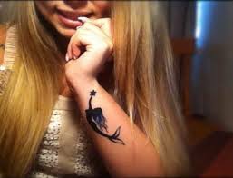 Black Small Mermaid Tattoo On Girl Left Side Wrist Mermaid Tattoos Small Mermaid Tattoo Mermaid Tattoo Designs