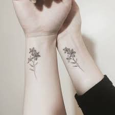 12 New Thoughts About Matching Flower Tattoos That Will Turn Your World Upside Down Matching Flow Tattoos For Daughters Mom Daughter Tattoos Matching Tattoos