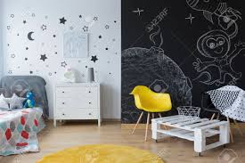 Take the chalk wall outside. Chalkboard Wall With Creative Drawings In Kid S Bedroom Stock Photo Picture And Royalty Free Image Image 67393444