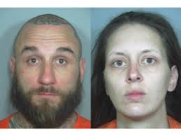 2 arrested after bodies found in burned truck