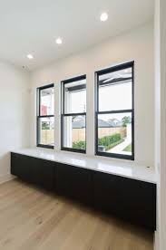 Weather Shiled Windows Jet Black Aluminum Clad Exterior With Primed Wood Interior Woodinteriordoors Windows Exterior Interior Windows Interior Barn Doors
