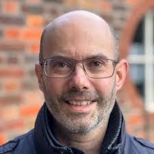 Today I updated my profile picture for the first time in about 15 years. It  came about after a colleague in a meeting told me my profile picture  "didn't pass 10b-5 scrutiny",