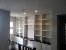 The desk part extends out when pulled down. New Built In Bookcases And Desk