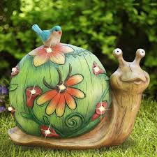 She is a pink snail who makes three hidden appearances in each episode. Amazon Com Garden Statue Snail Figurine Solar Powered Resin Animal Sculpture Indoor Outdoor Fall Winter Christmas Decorations Patio Lawn Yard Art Ornaments 10 X 8 5 Inch Home Improvement