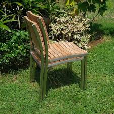 These chairs are crafted from solid teak wood with clean lines and slatted backs that let them fit right in with your coastal outdoor. Posh Pollen Laguna Stainless Steel Teak Outdoor Patio Dining Chairs Set Of 2 Overstock 31609429