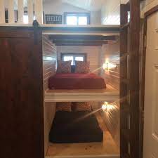 At night, they fold down the office wall to reveal a queen size bed, turning their office into the master bedroom. This Would Be Very Interesting For A Guest House Tiny House Bedroom Tiny House Loft Best Tiny House
